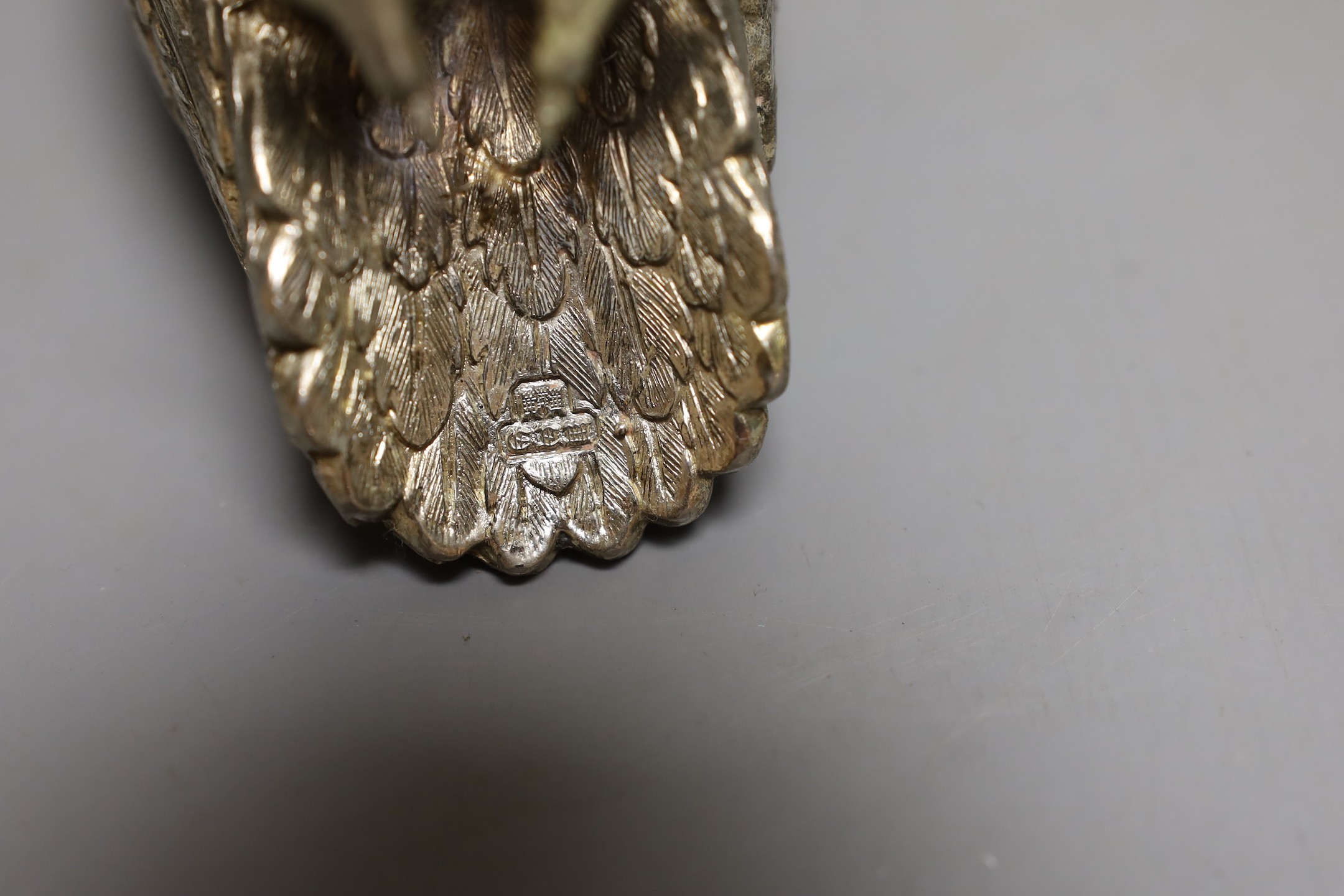 A silvered metal ‘owl’ sugar caster, 13cm